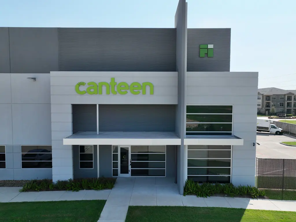 Modern building facade with "canteen" signage.