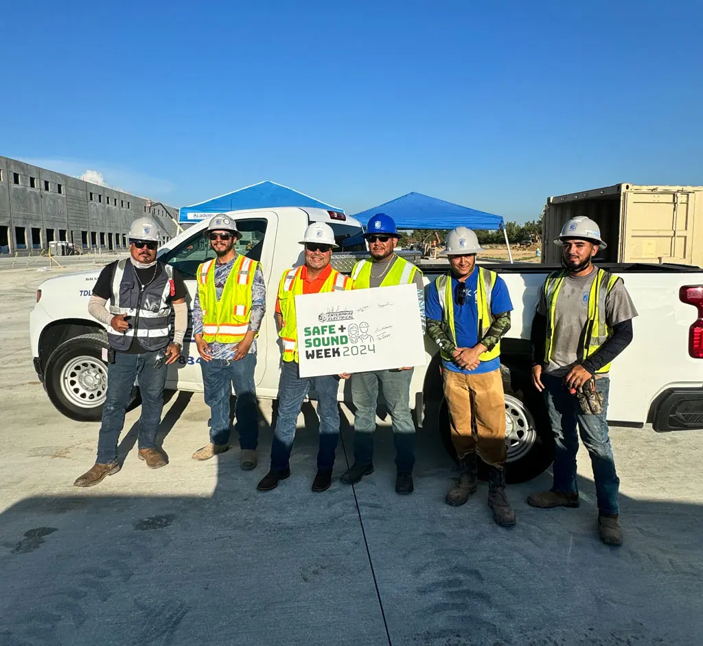 Construction workers promoting Safe + Sound Week.