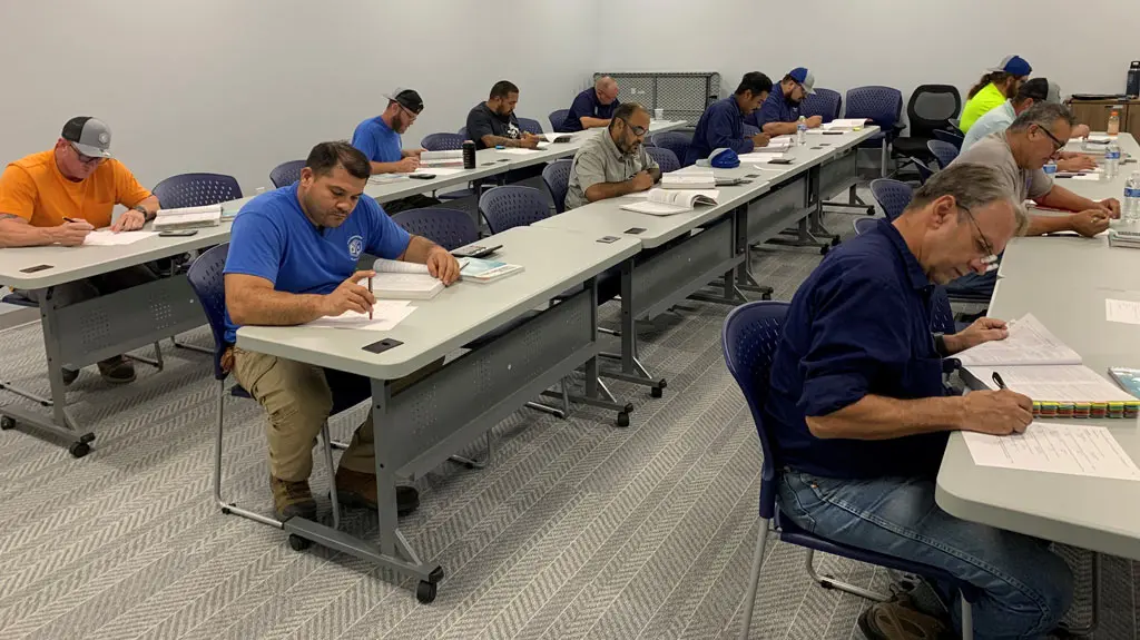 Individuals attending a classroom training session.