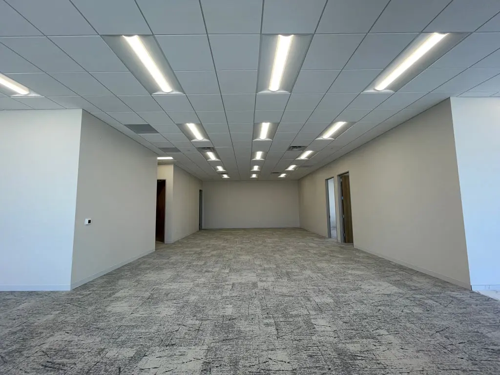 Empty office space with modern lighting.