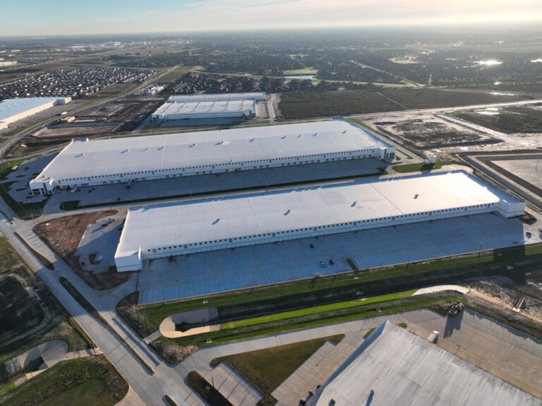 Aerial view of large industrial buildings.