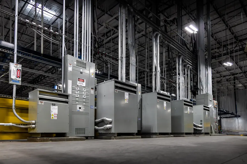 Industrial equipment with electrical panels and pipes.